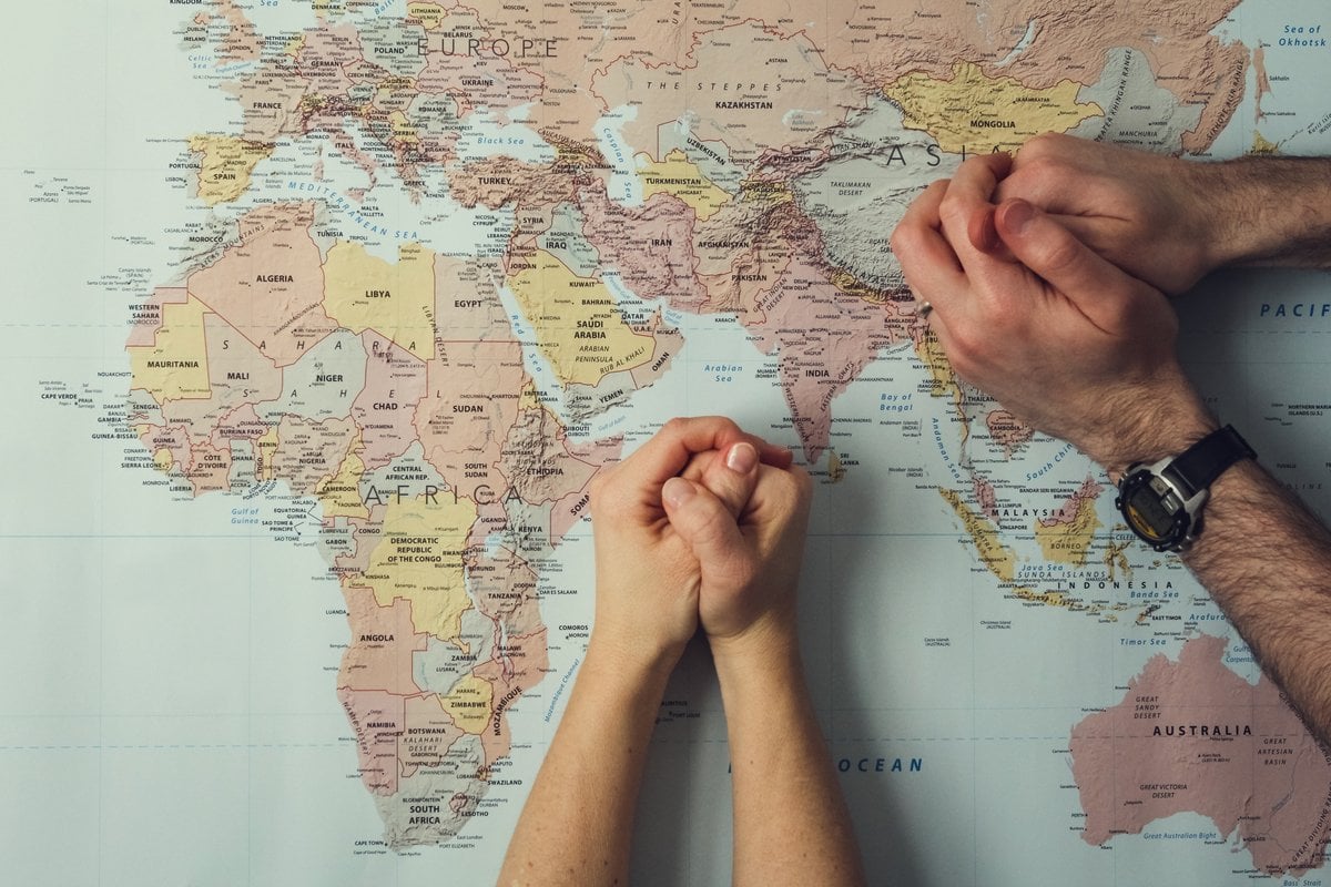 map-of-world-praying-hands